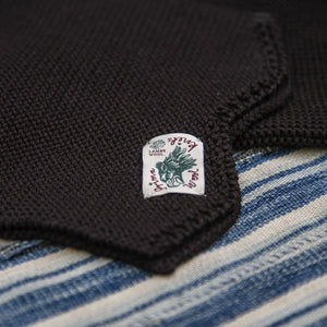 Indigofera Chilcoot Merino Wool Scarf Brown close up label