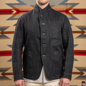 MotivMfg Peak Lapel Herringbone Denim Lounge Jacket Black worn front high collar