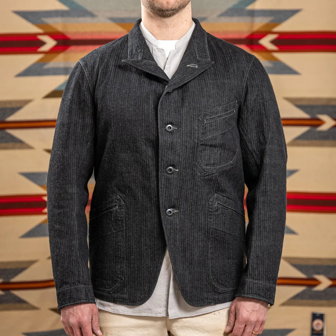 MotivMfg Peak Lapel Herringbone Denim Lounge Jacket Black worn front