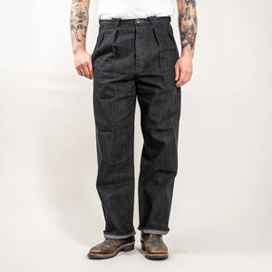 MotivMfg Pleat Herringbone Denim Trousers Black Classic Straight worn front