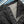 MotivMfg Pleat Herringbone Denim Trousers Black Classic Straight close up button fly