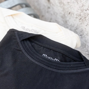 MotivMfg Supima Cotton Silk Shuttle TShirt Ivory detail neckline together with black