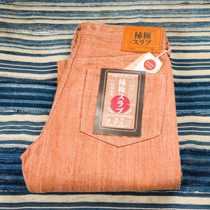 Studio D Artisan 45th Anniversary 16oz Kakishibu Slub Jeans brown folded