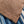 Sunspel Linen Pique Polo Shirt Dark Walnut close up hem