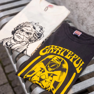 TSPTR Grateful Dredd T-Shirt Vintage Black folded together with another tsptr tshirt